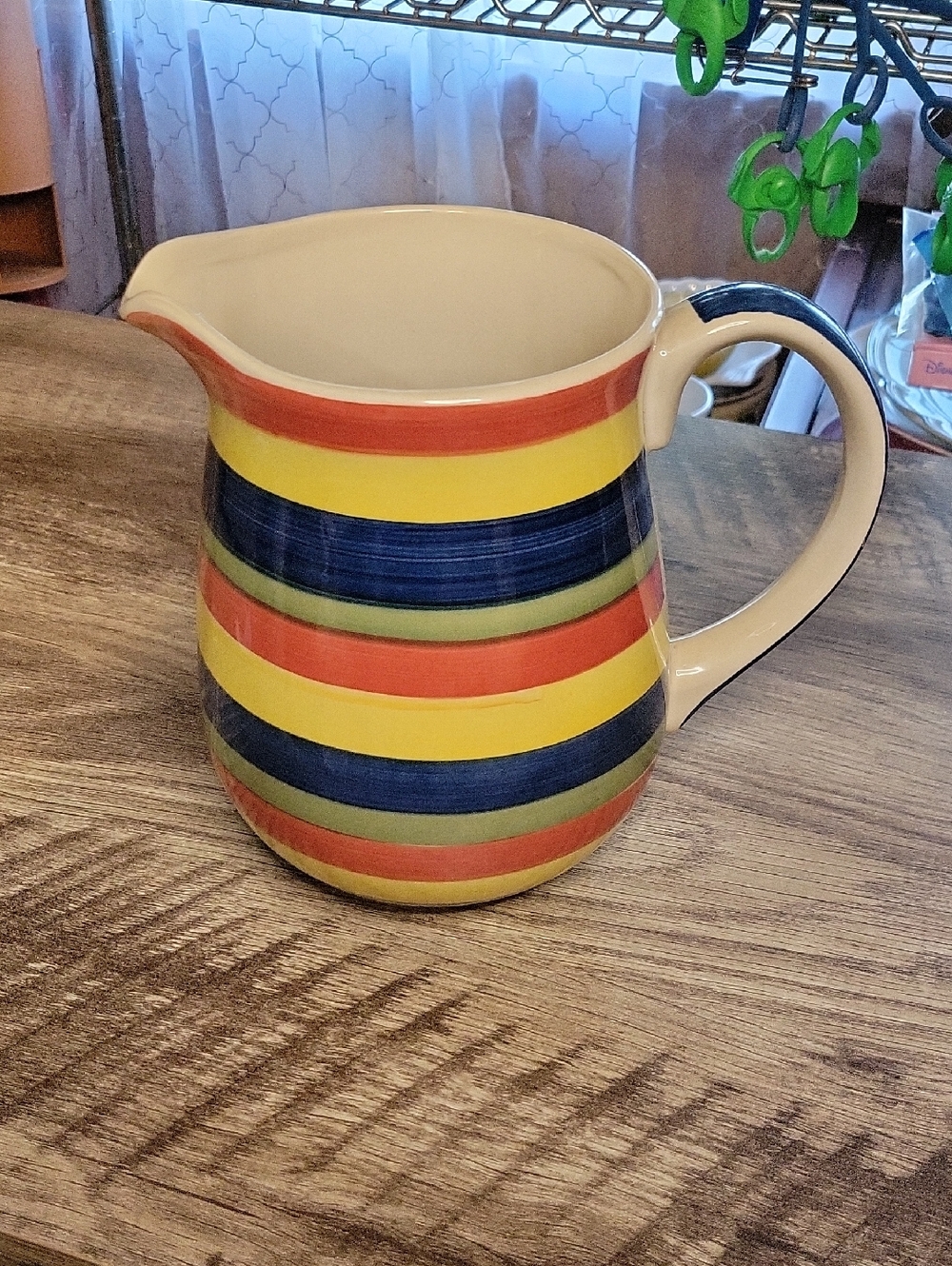 Striped Ceramic Pitcher in Yellow, Blue, Red, and Green